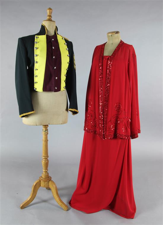 Tosca: A rail of yellow and maroon jackets, a red evening dress and jacket, white cotton nightdresses, a sheepskin